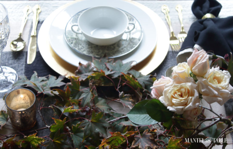 Moody Fall Table view of place setting with roses in the foreground