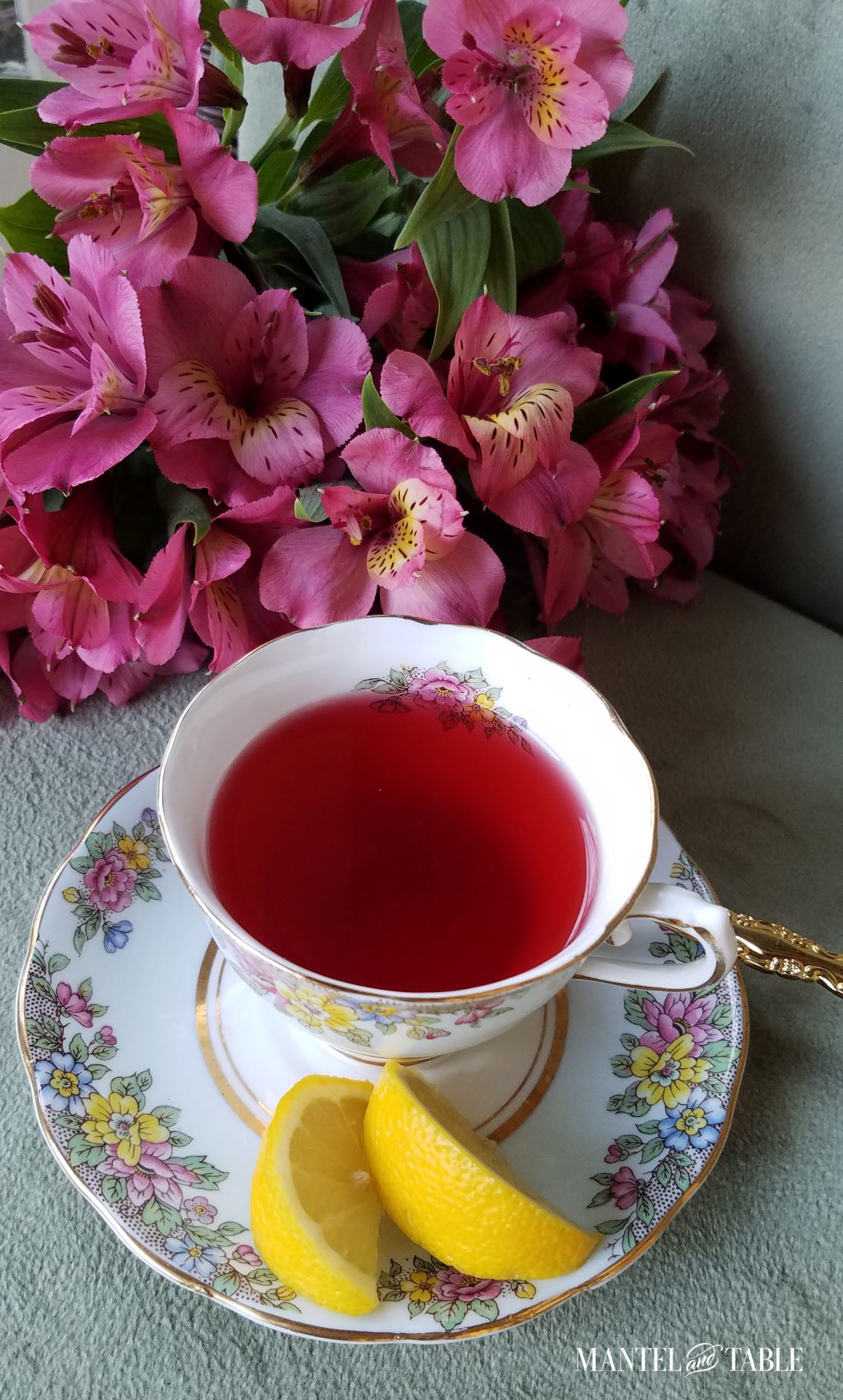 Top view of Cloclough teacup, with red tea and lemon slices on saucer