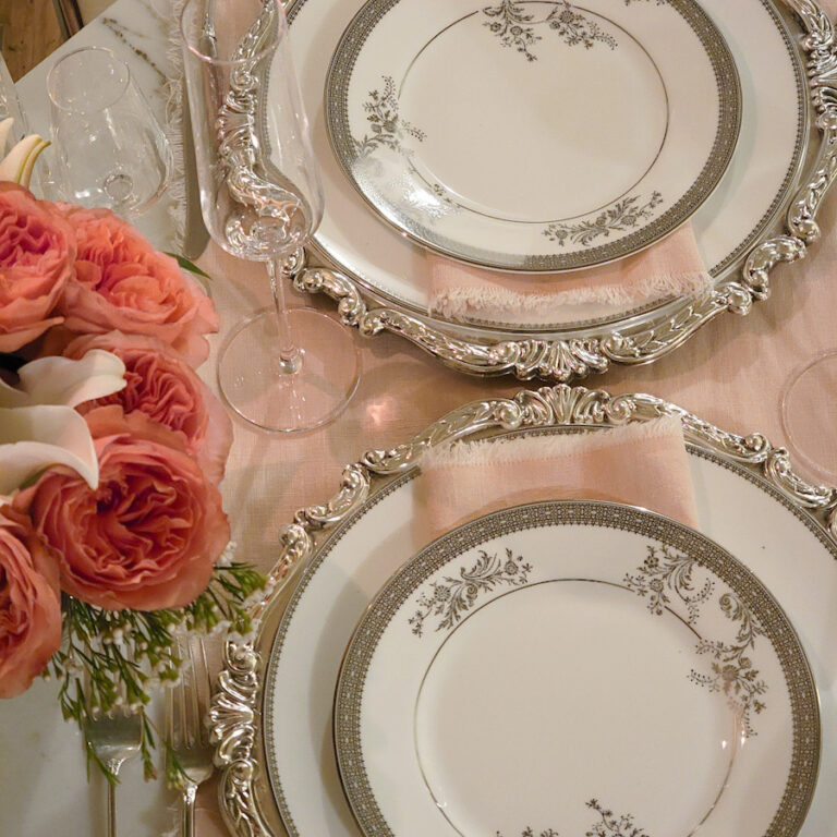 An intimate table for two with beautiful blush and silver