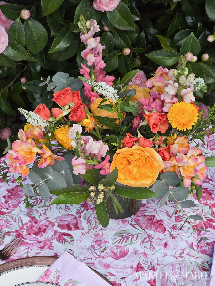 Closeup of bright pink, yellow, and orange flower arrangement